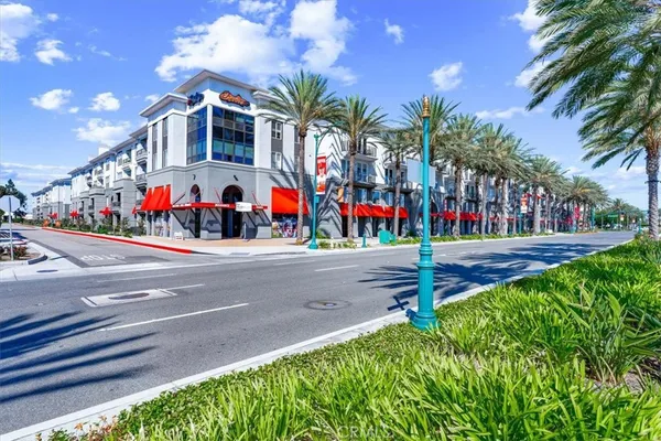 a view of street with palm trees