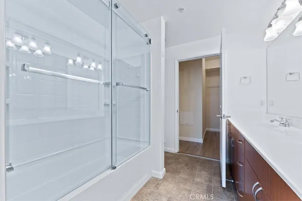 a bathroom with a bathtub and shower