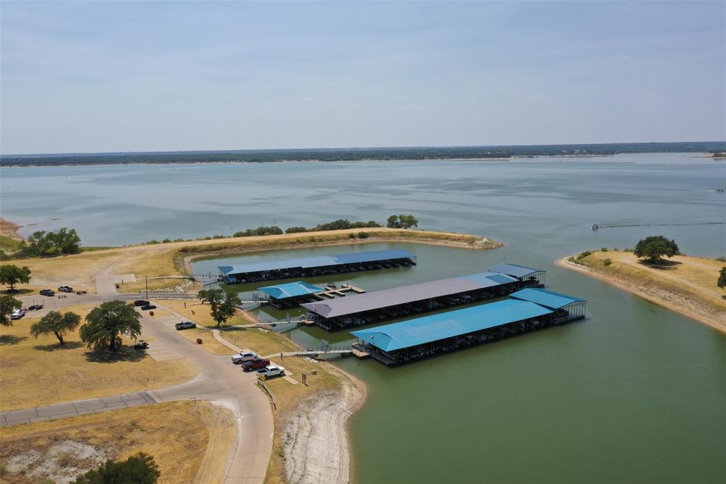 39345 Cedar Trail Whitney, TX 76692 - Photo 11 of 39 a view of a lake with lawn chairs