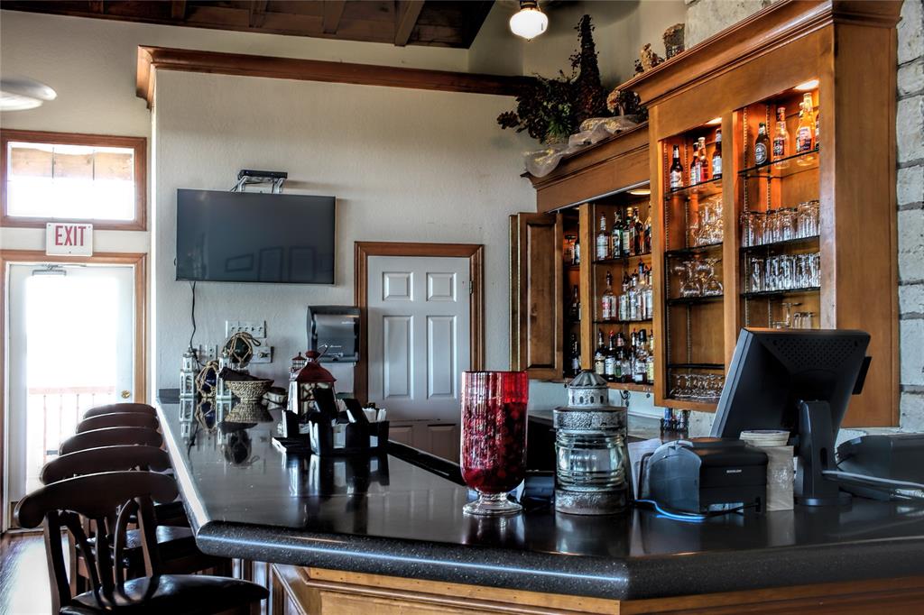 39345 Cedar Trail Whitney, TX 76692 - Photo 20 of 39 a view of a workspace with furniture and floor to ceiling window