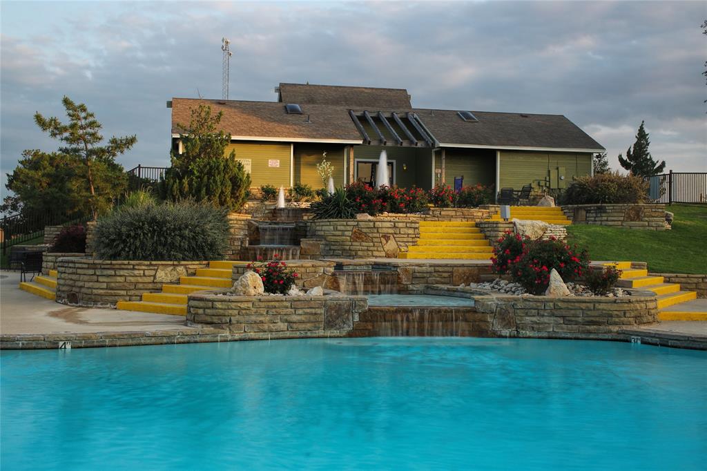 39345 Cedar Trail Whitney, TX 76692 - Photo 26 of 39 a front view of a house with swimming pool having outdoor seating