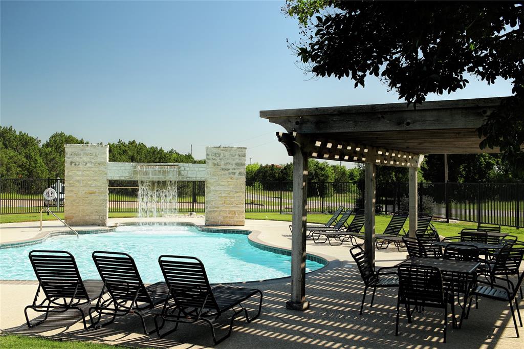 39345 Cedar Trail Whitney, TX 76692 - Photo 31 of 39 a view of a patio with table and chairs potted plants with wooden floor and fence