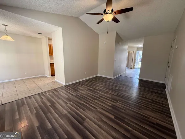 a kitchen with a sink a refrigerator and a stove