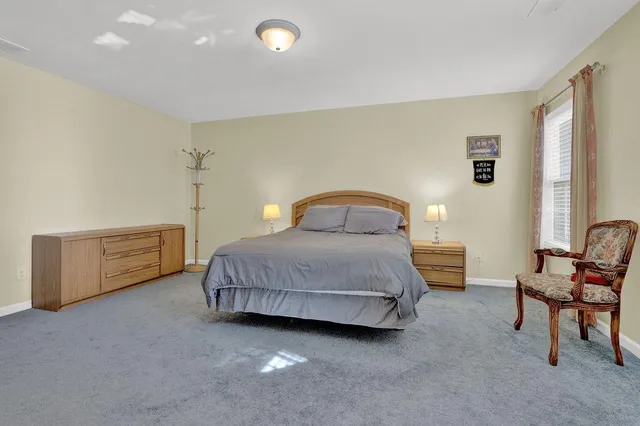 a bathroom with a tub a sink and mirrors
