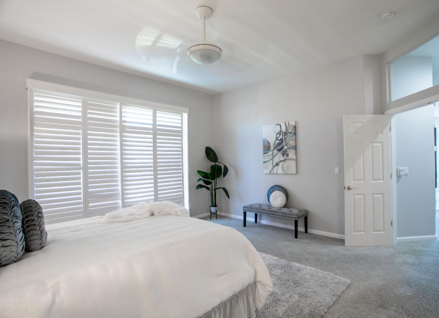 2049 Folle Blanche Drive San Jose, CA 95135 - Photo 14 of 42 a bedroom with a bed and a chandelier