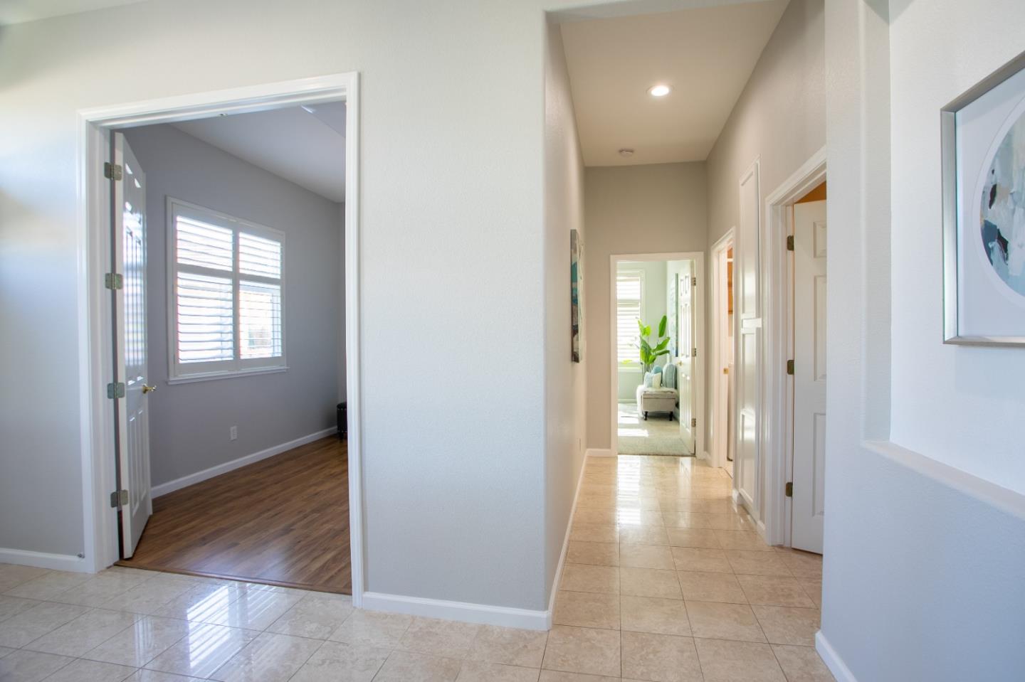 2049 Folle Blanche Drive San Jose, CA 95135 - Photo 19 of 42 a view of a hallway with wooden shelves