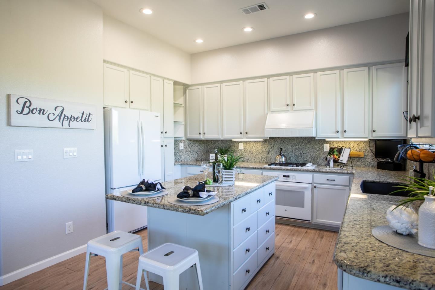 2049 Folle Blanche Drive San Jose, CA 95135 - Photo 9 of 42 a kitchen with a refrigerator and white cabinets
