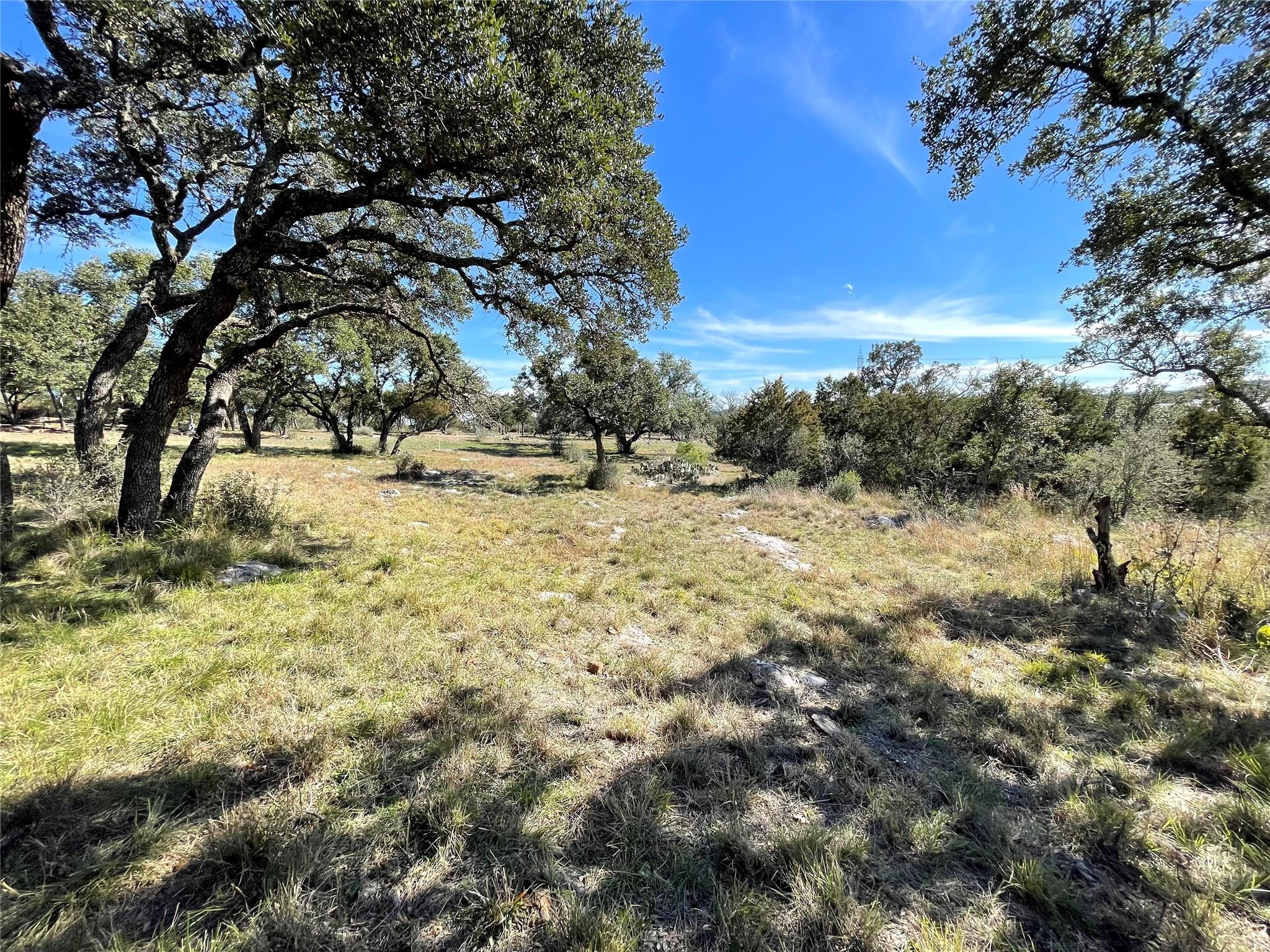 Lot 41118 Hi Ridge Road Horseshoe Bay, TX 78657 - Photo 8 of 10 A sprawling natural landscape with mature trees and ample space awaits your vision.