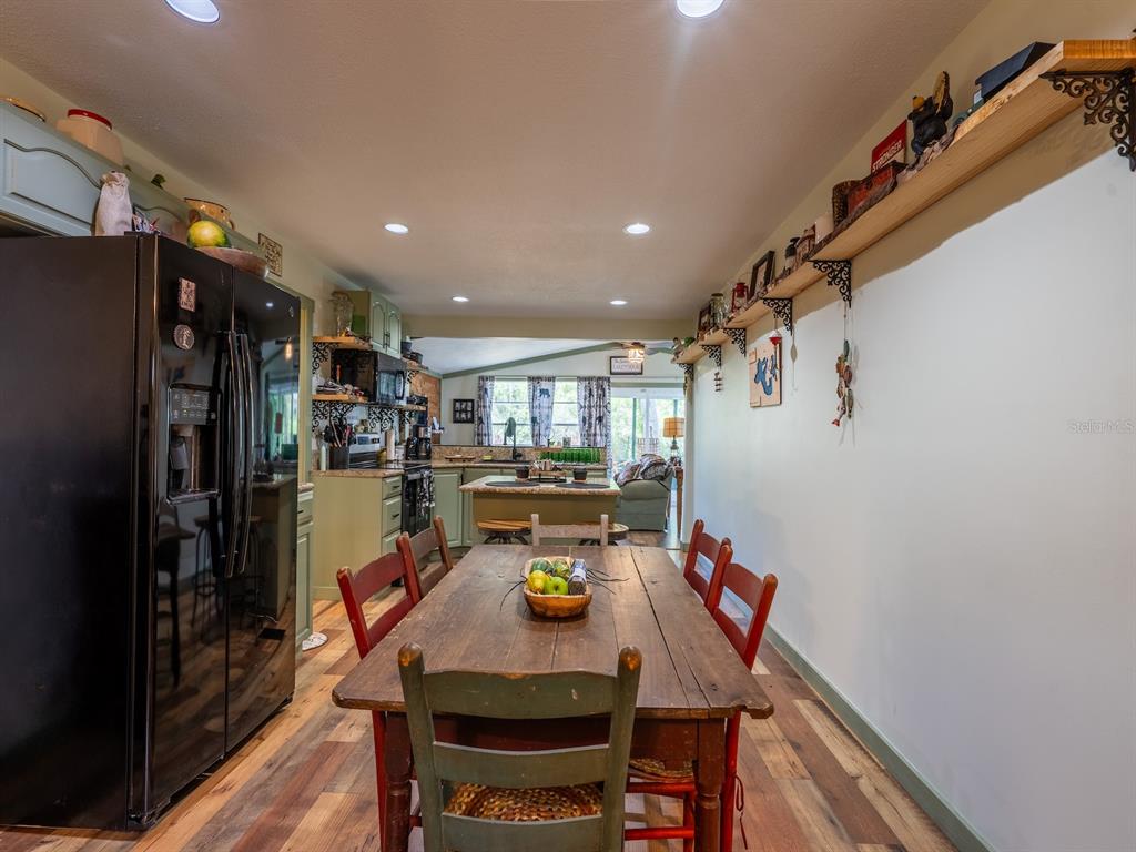 24855 Northeast 135th Street Salt Springs, FL 32134 - Photo 12 of 53 a very nice looking dining room with furniture