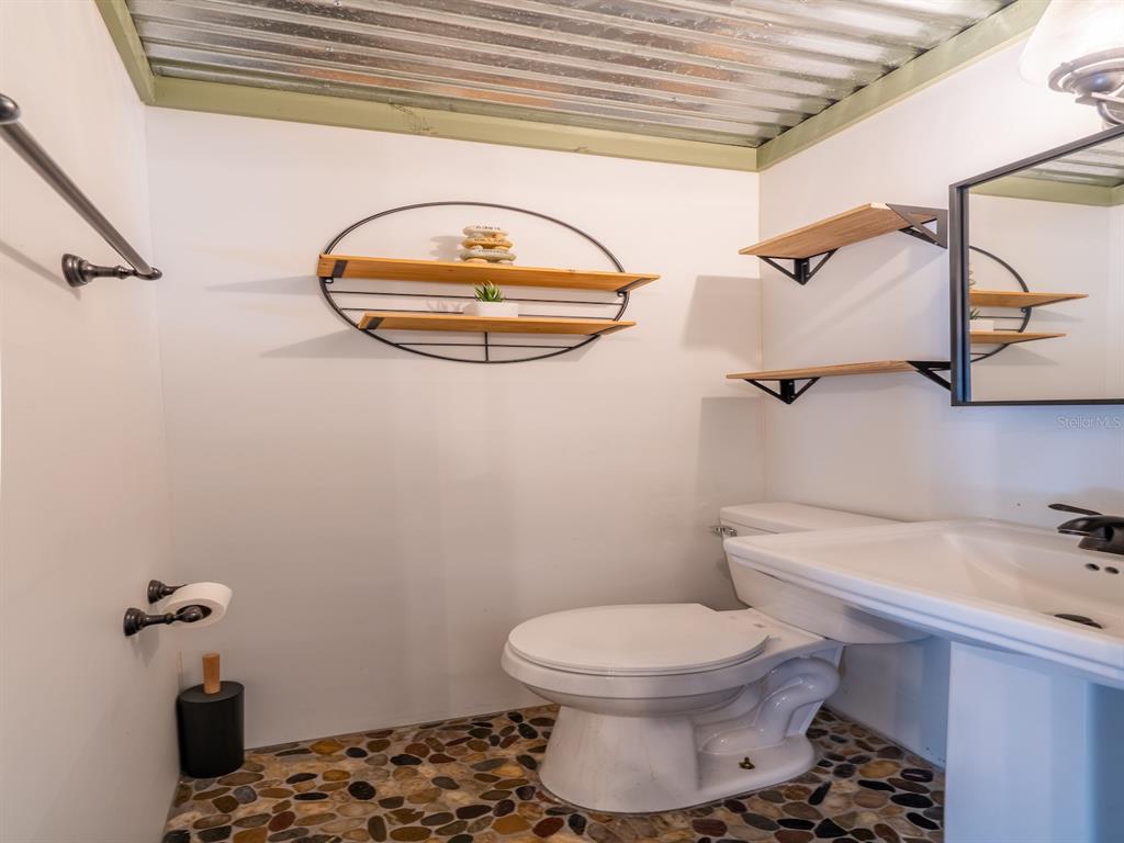 24855 Northeast 135th Street Salt Springs, FL 32134 - Photo 19 of 53 a bathroom with a toilet and a sink