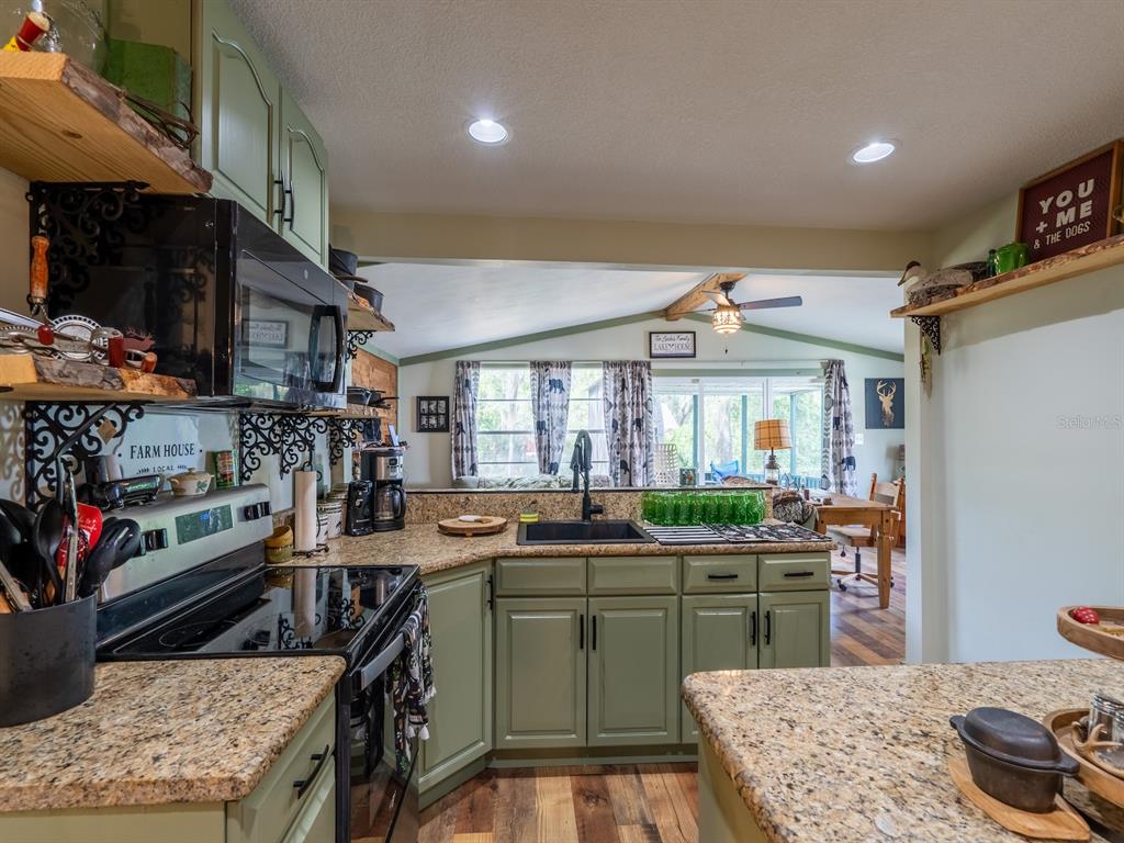 24855 Northeast 135th Street Salt Springs, FL 32134 - Photo 22 of 53 a kitchen with lots of counter top space