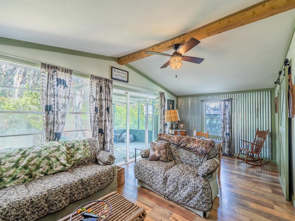 24855 Northeast 135th Street Salt Springs, FL 32134 - Photo 26 of 53 a living room with furniture and a large window