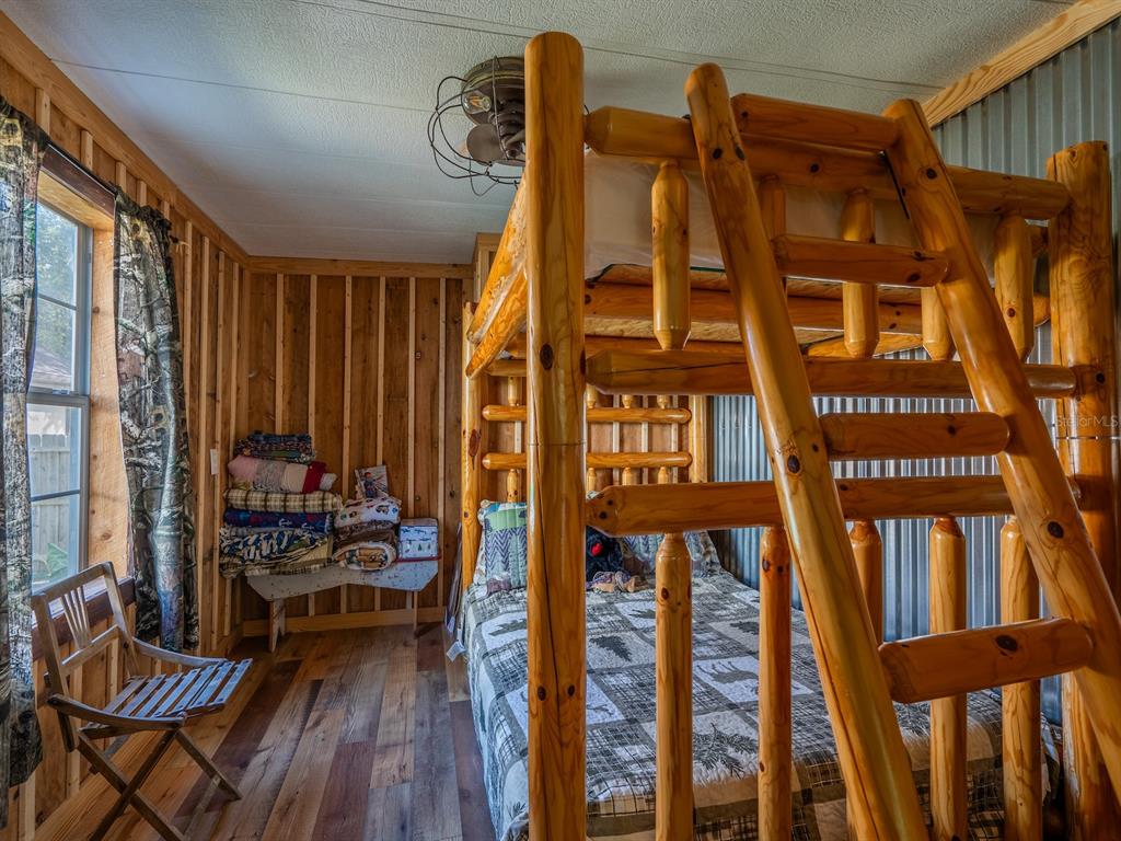 24855 Northeast 135th Street Salt Springs, FL 32134 - Photo 28 of 53 a view of living room with furniture and wooden floor