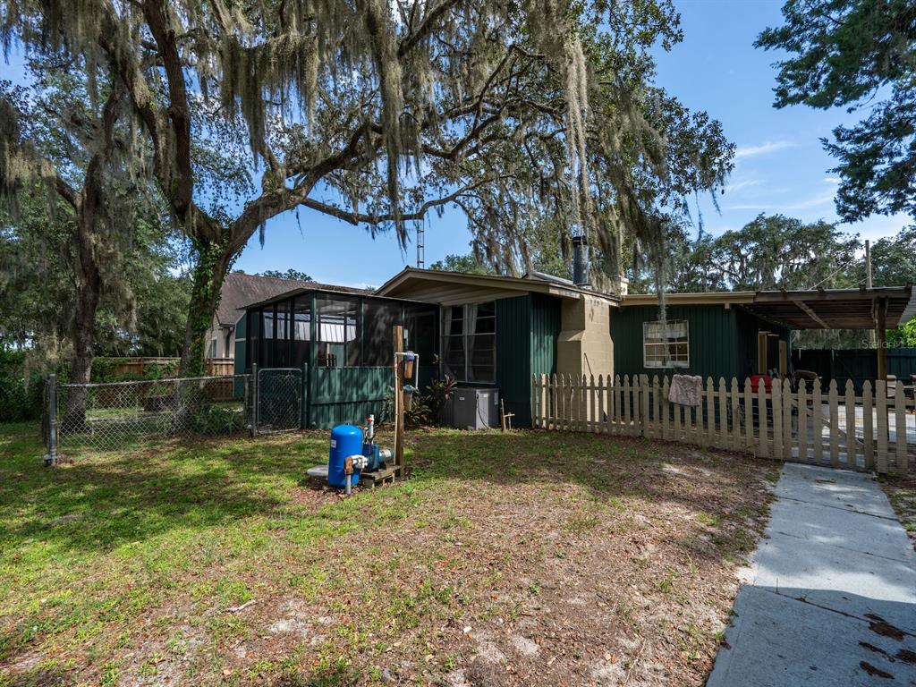 24855 Northeast 135th Street Salt Springs, FL 32134 - Photo 44 of 53 a view of a house with a yard balcony and wooden fence