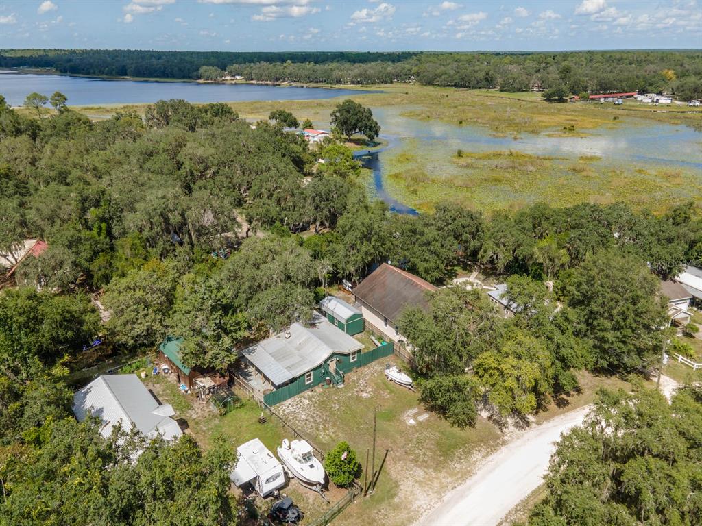 24855 Northeast 135th Street Salt Springs, FL 32134 - Photo 48 of 53 an aerial view of residential house with outdoor space and lake view