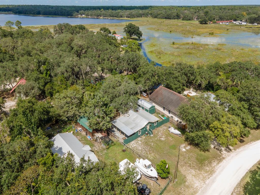 24855 Northeast 135th Street Salt Springs, FL 32134 - Photo 50 of 53 an aerial view of residential houses with outdoor space and river