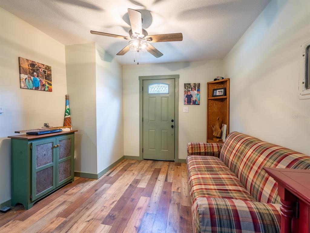 24855 Northeast 135th Street Salt Springs, FL 32134 - Photo 7 of 53 a bedroom with a bed and wooden floor