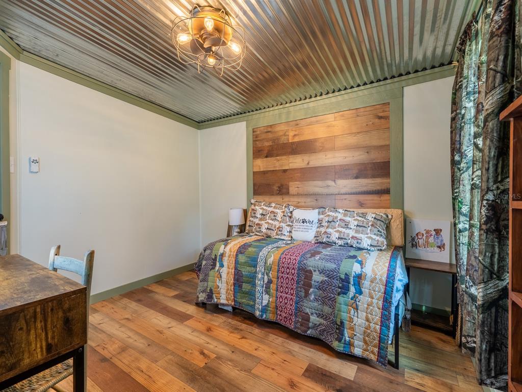 24855 Northeast 135th Street Salt Springs, FL 32134 - Photo 10 of 53 a bedroom with a bed and a window