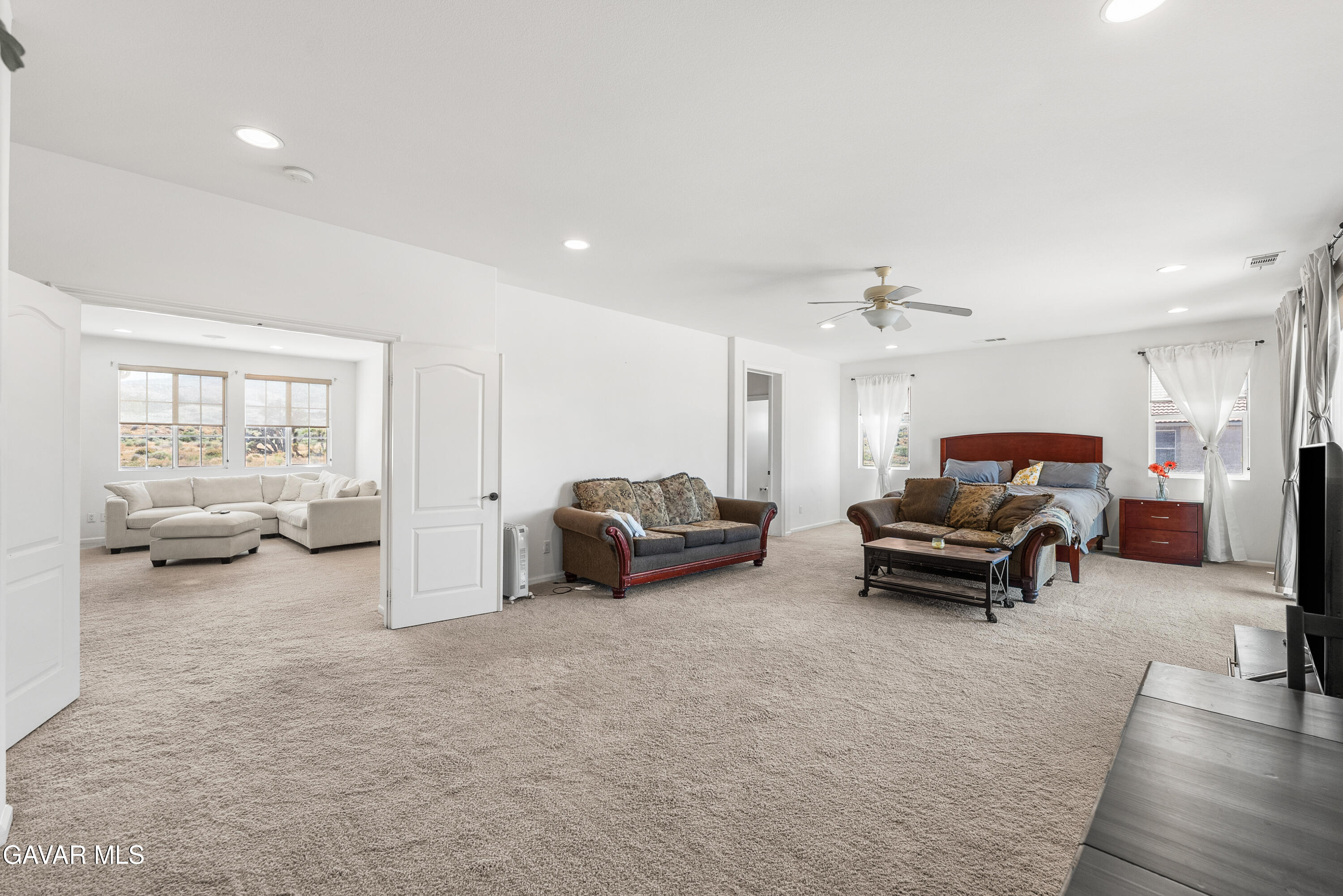 658 Lago Lindo Road Palmdale, CA 93550 - Photo 49 of 91 a living room with furniture and a flat screen tv