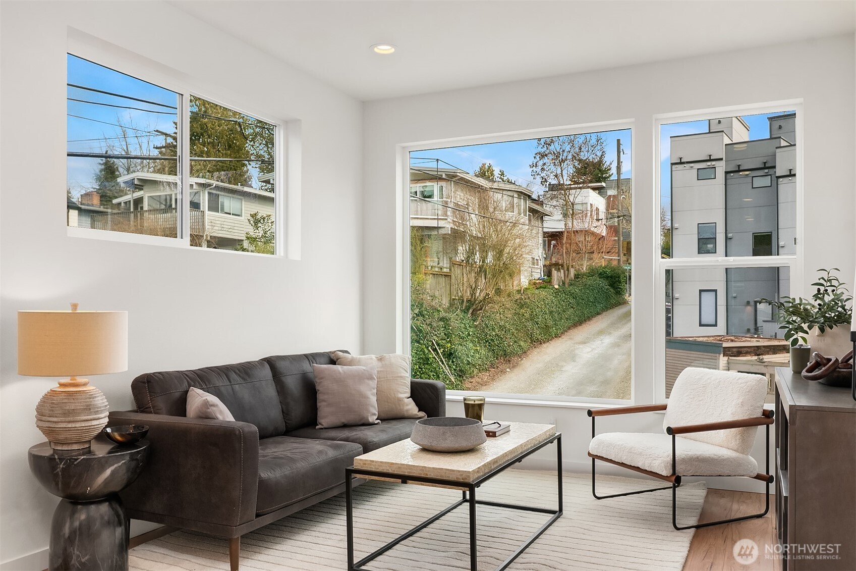 223 Northeast 75th Street Seattle, WA 98115 - Photo 14 of 33 a living room with furniture and a large window