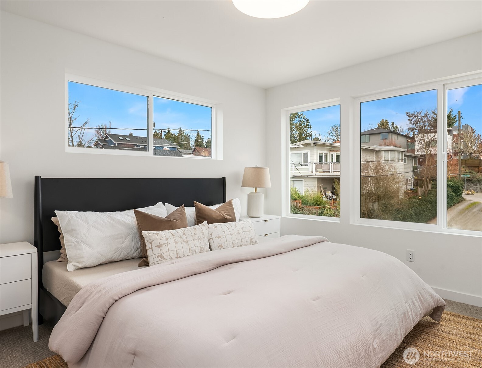 223 Northeast 75th Street Seattle, WA 98115 - Photo 22 of 33 a bedroom with a bed and window