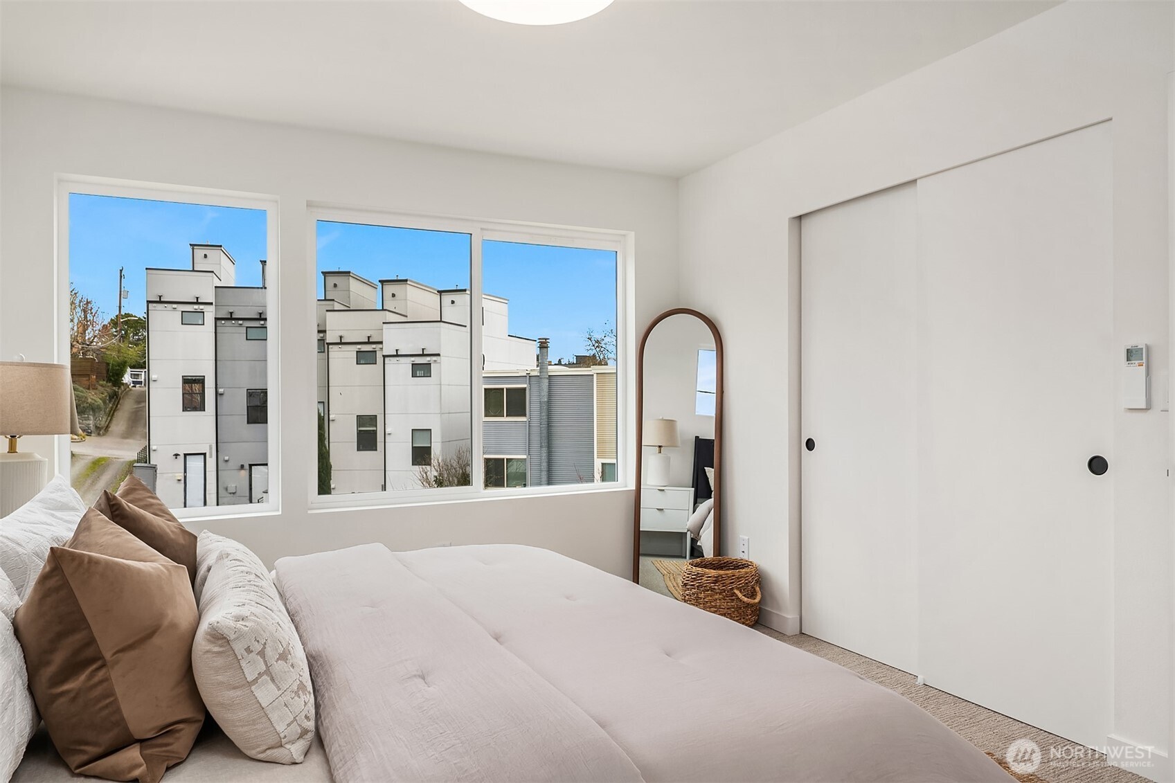 223 Northeast 75th Street Seattle, WA 98115 - Photo 25 of 33 a bed room with a bed and a large window