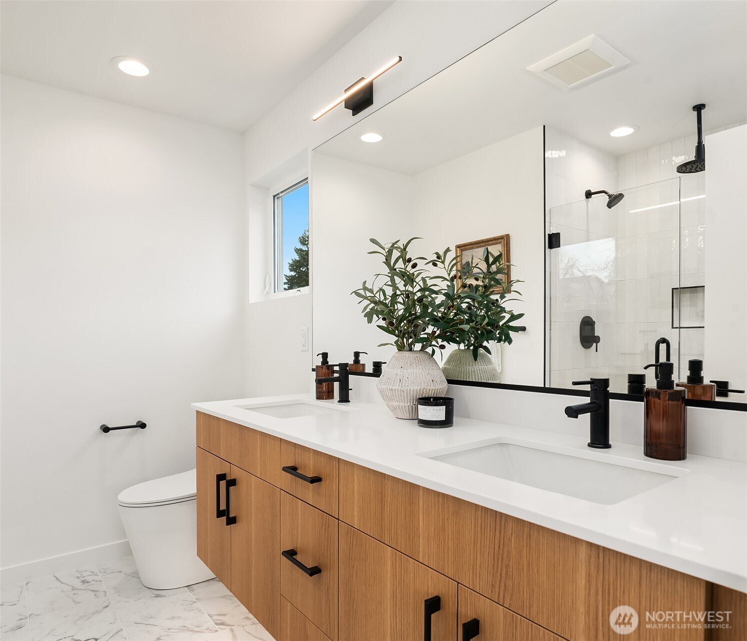 223 Northeast 75th Street Seattle, WA 98115 - Photo 26 of 33 a bathroom with a sink double vanity and a mirror