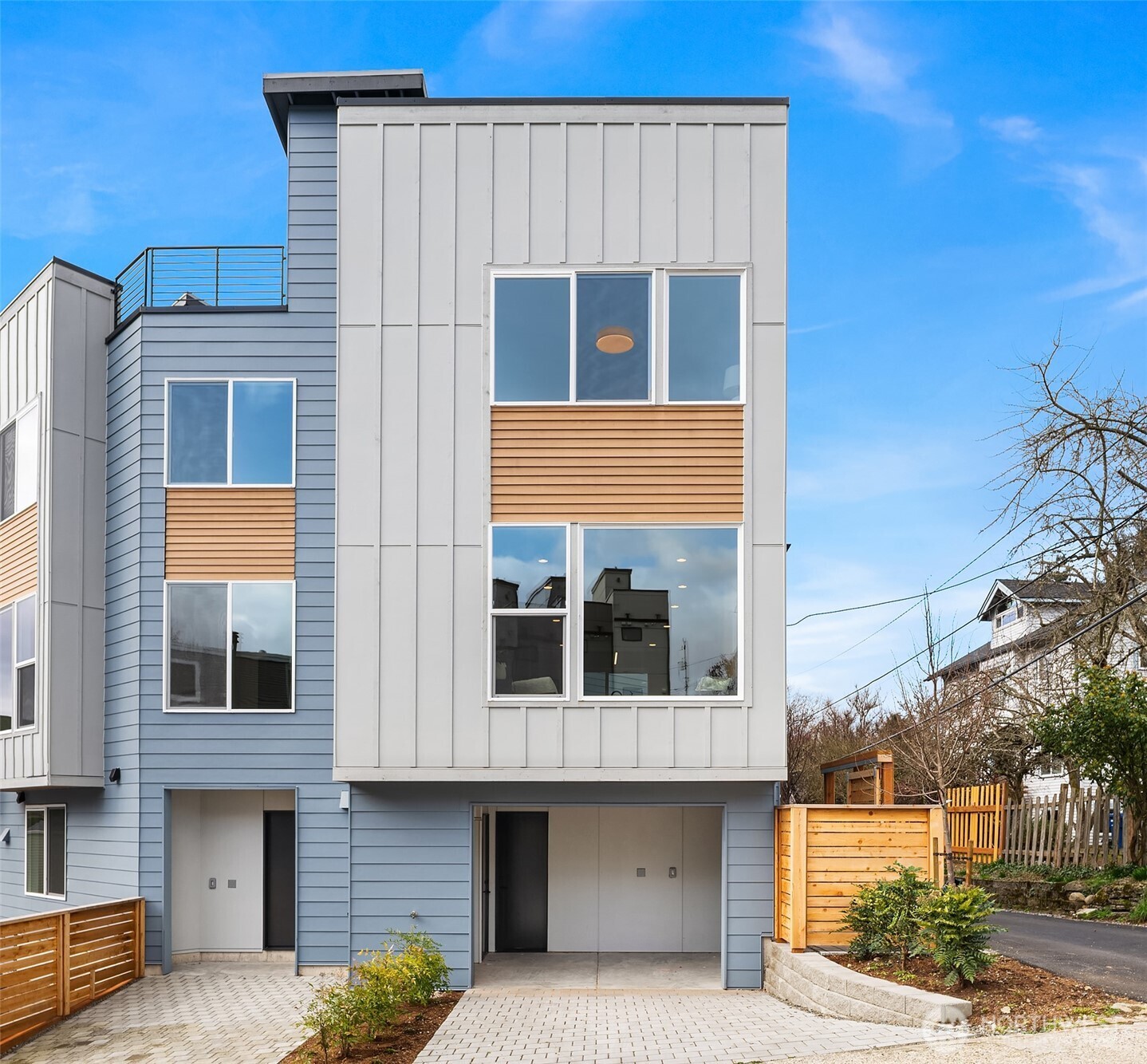 223 Northeast 75th Street Seattle, WA 98115 - Photo 33 of 33 a front view of a house with large windows