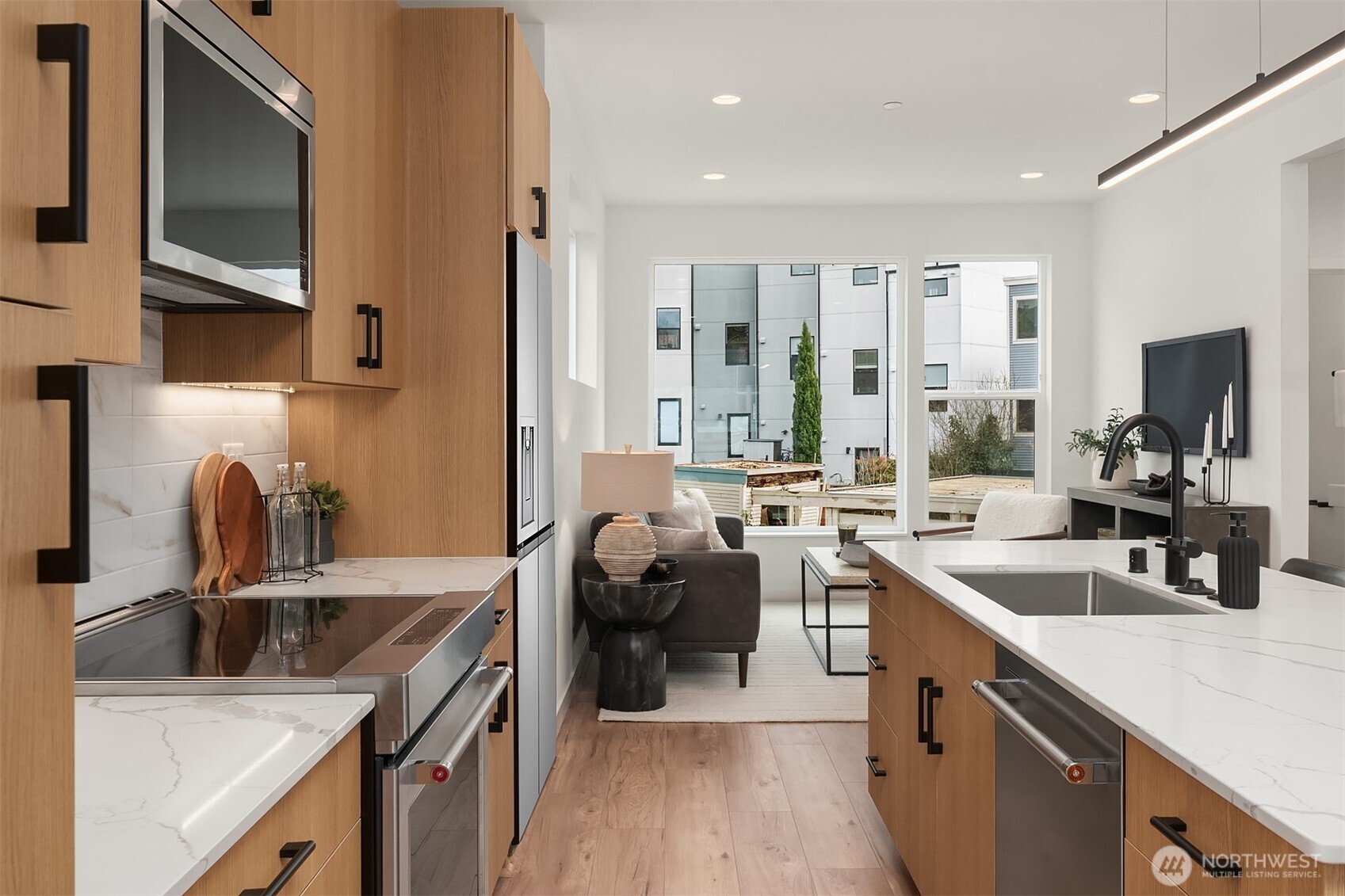 223 Northeast 75th Street Seattle, WA 98115 - Photo 8 of 33 a kitchen with a sink stove and refrigerator