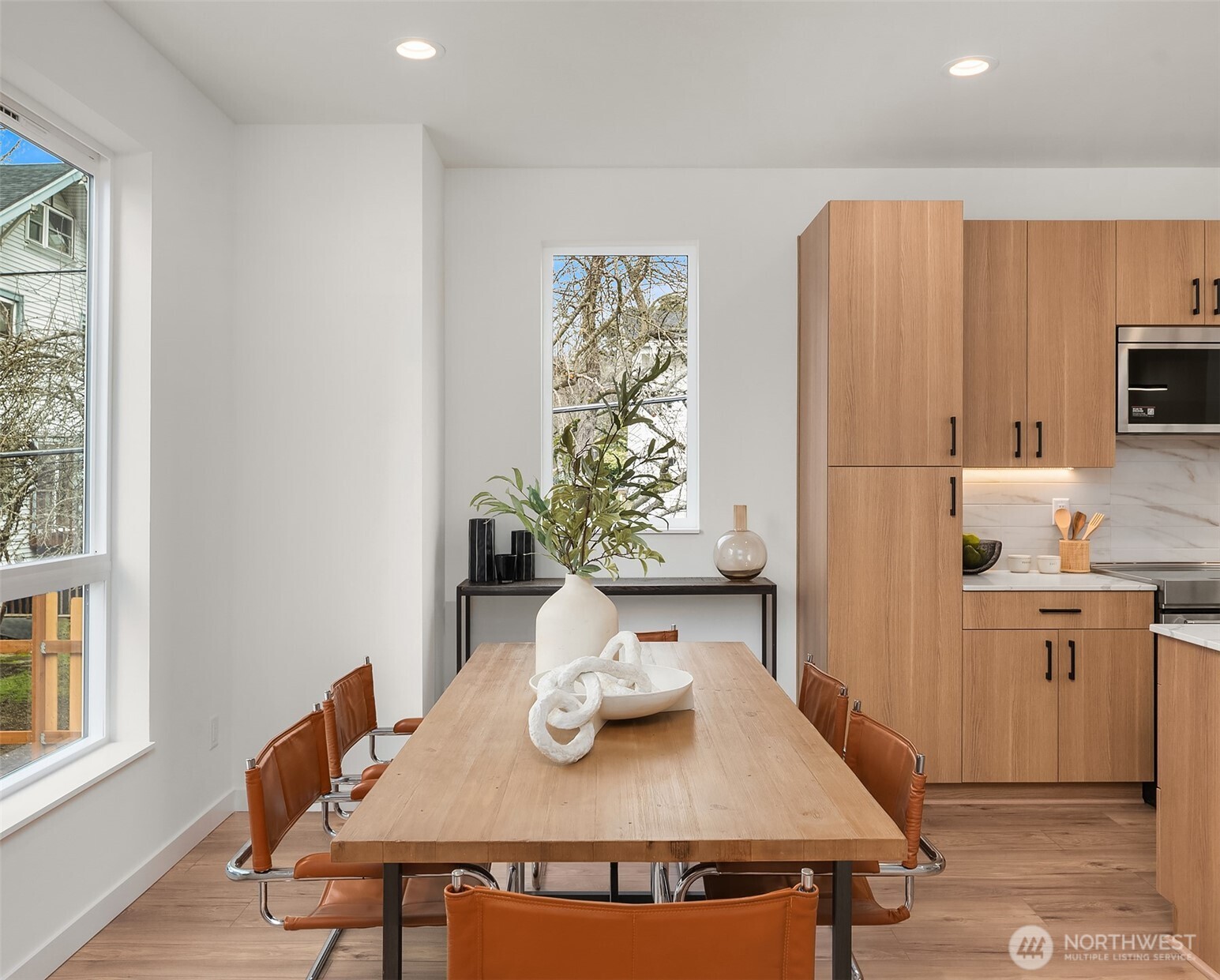 223 Northeast 75th Street Seattle, WA 98115 - Photo 10 of 33 a view of a dining room with furniture and a window
