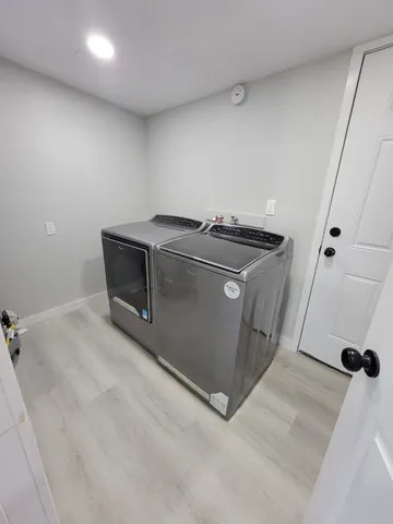 an empty room with wooden floor