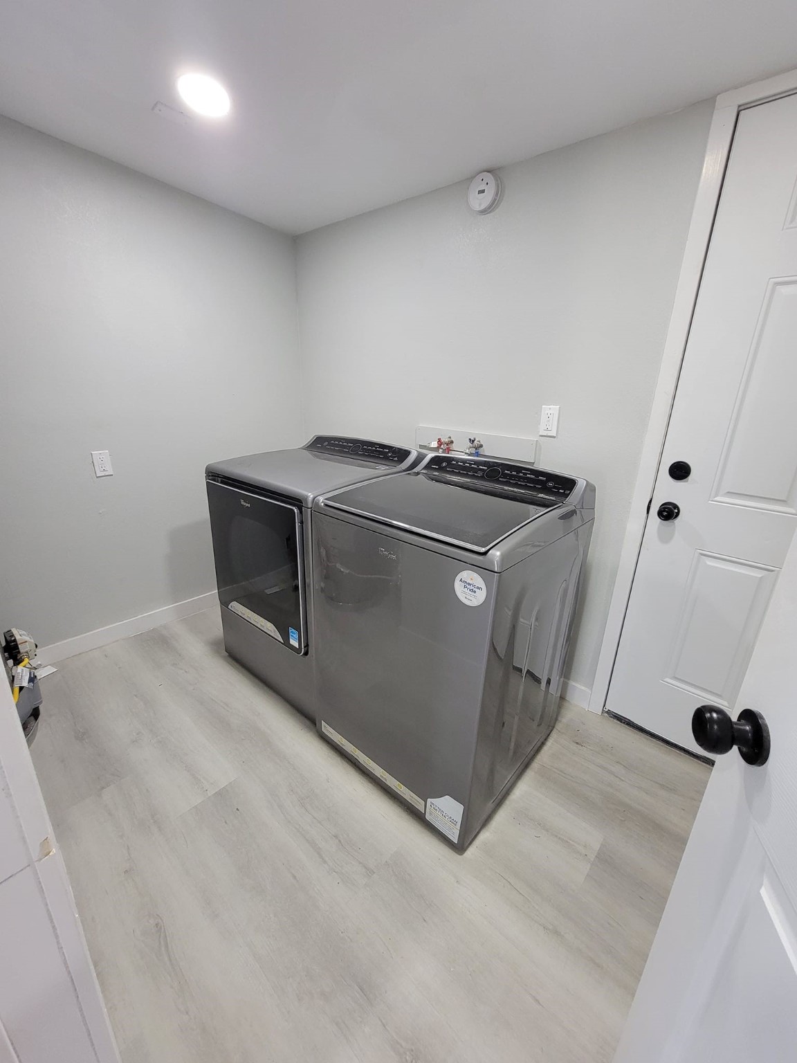 801 Willcox Street Anahuac, TX 77514 - Photo 5 of 10 an empty room with wooden floor