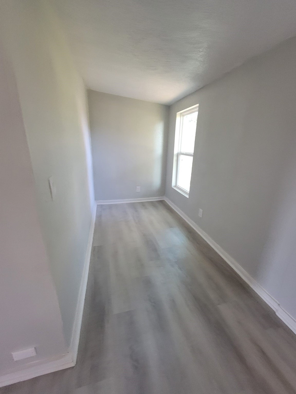 801 Willcox Street Anahuac, TX 77514 - Photo 10 of 10 a view of empty room with window
