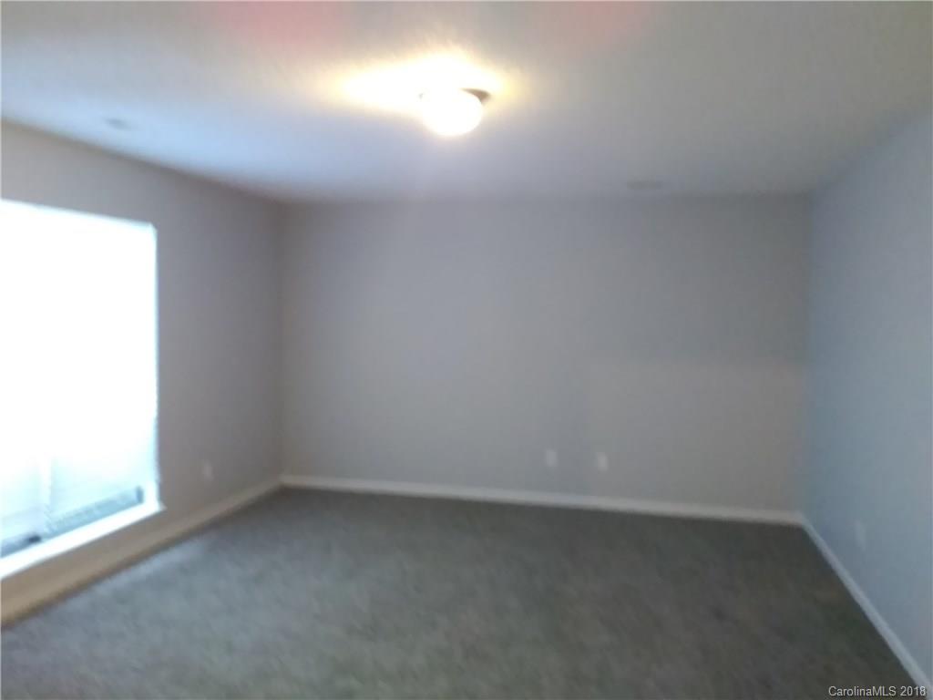 5832 Vernedale Road Charlotte, NC 28212 - Photo 8 of 16 a view of an empty room and a window