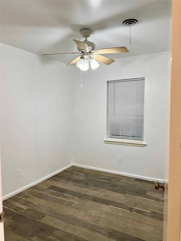 2529 Rutgers Drive Irving, TX 75062 - Photo 26 of 38 Room featuring wood-finish flooring, a ceiling fan with integrated lighting, a window with horizontal blinds, and white baseboards