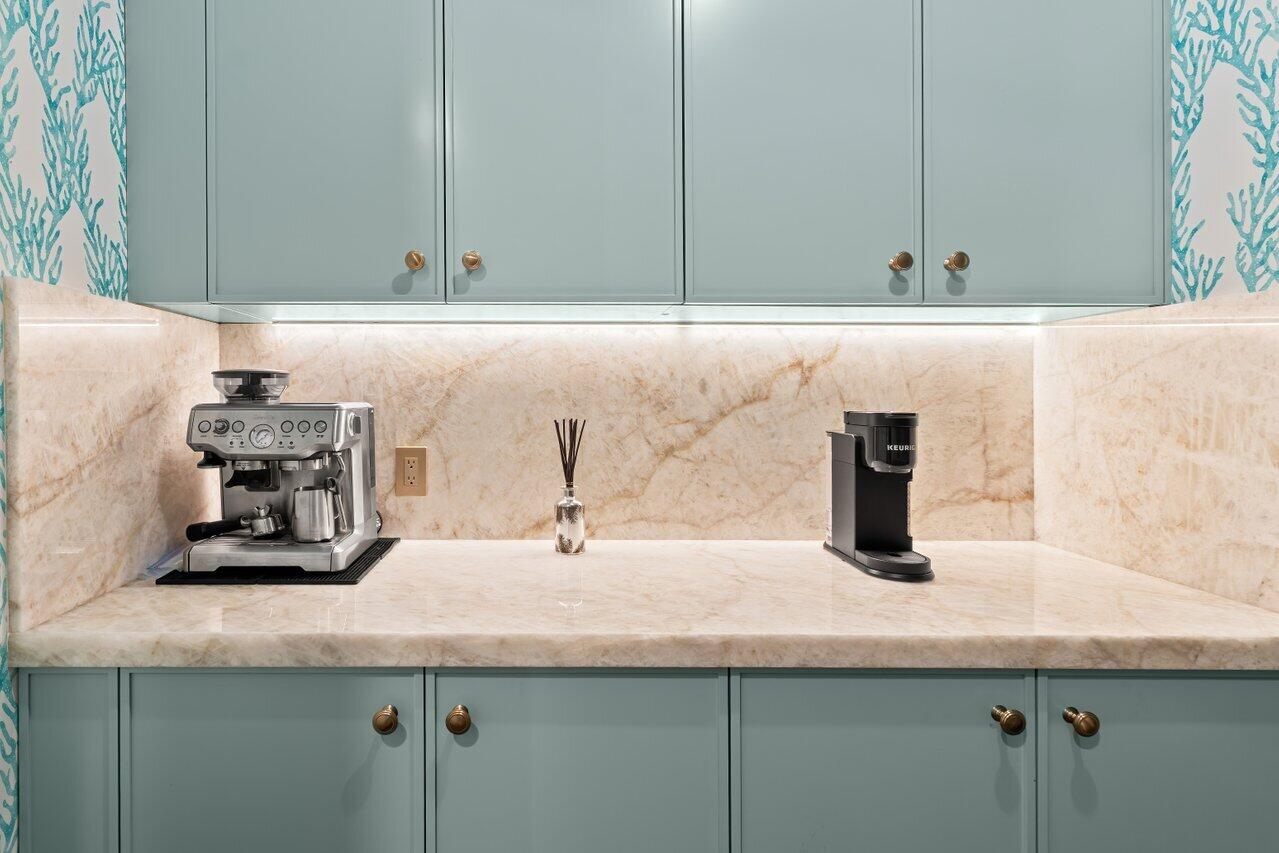 5 Osprey Court Ocean Ridge, FL 33435 - Photo 14 of 39 a kitchen with a sink and cabinets