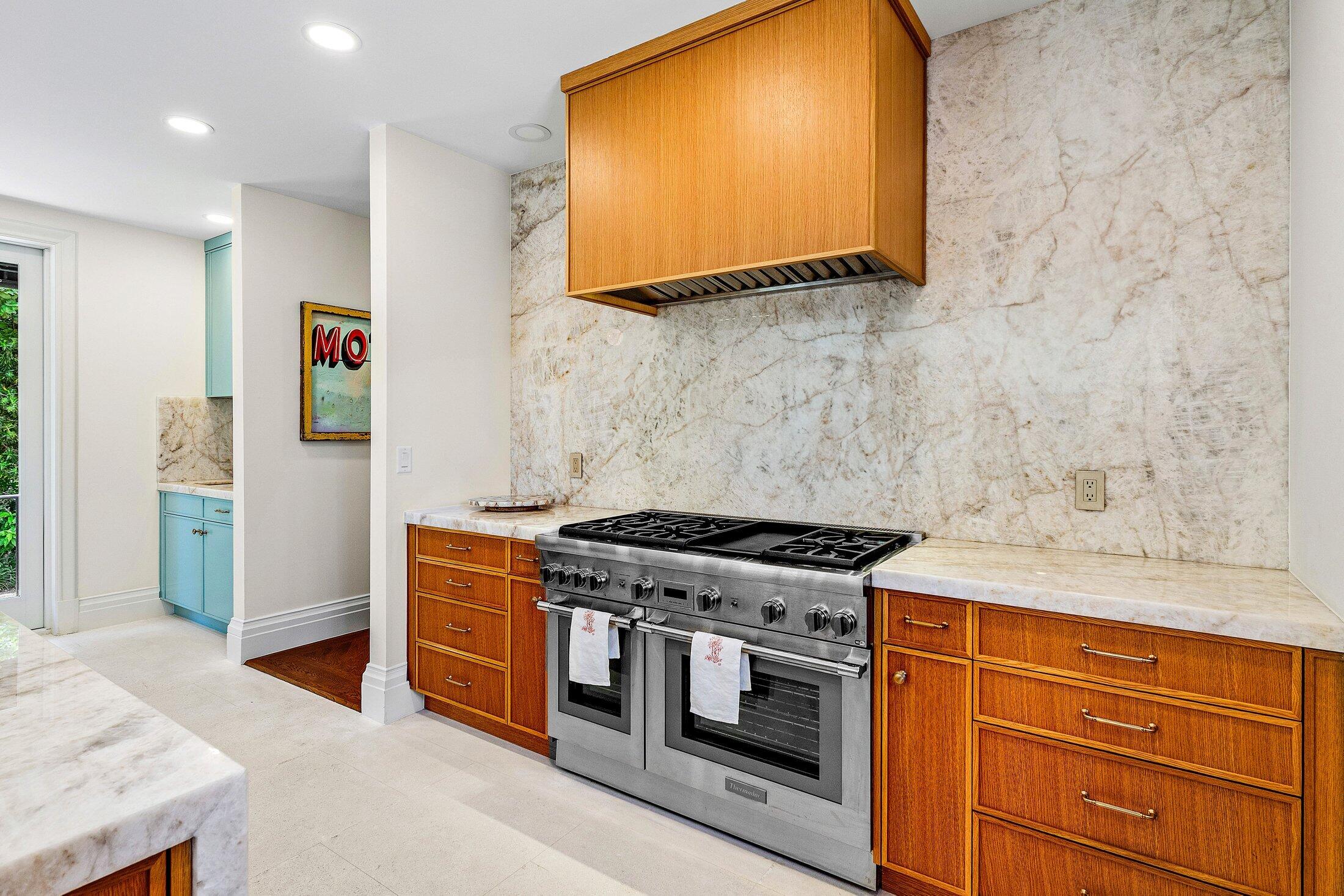 5 Osprey Court Ocean Ridge, FL 33435 - Photo 17 of 39 a kitchen with stainless steel appliances granite countertop a stove and a microwave