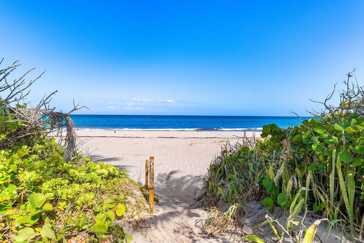 5 Osprey Court Ocean Ridge, FL 33435 - Photo 2 of 39 a view of a lake with a big yard