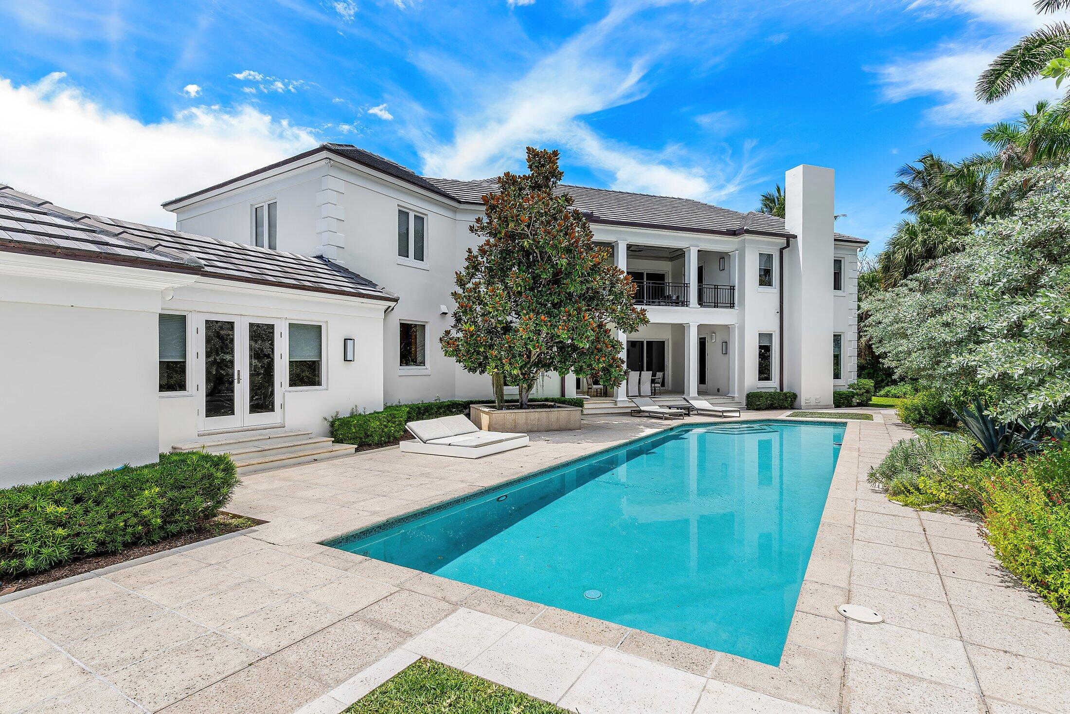 5 Osprey Court Ocean Ridge, FL 33435 - Photo 22 of 39 a front view of a house with garden