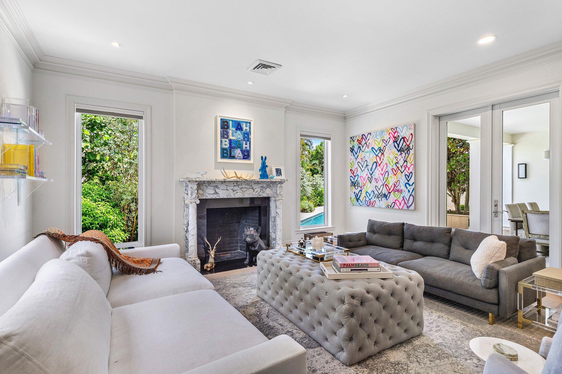 5 Osprey Court Ocean Ridge, FL 33435 - Photo 25 of 39 a living room with furniture and a fireplace