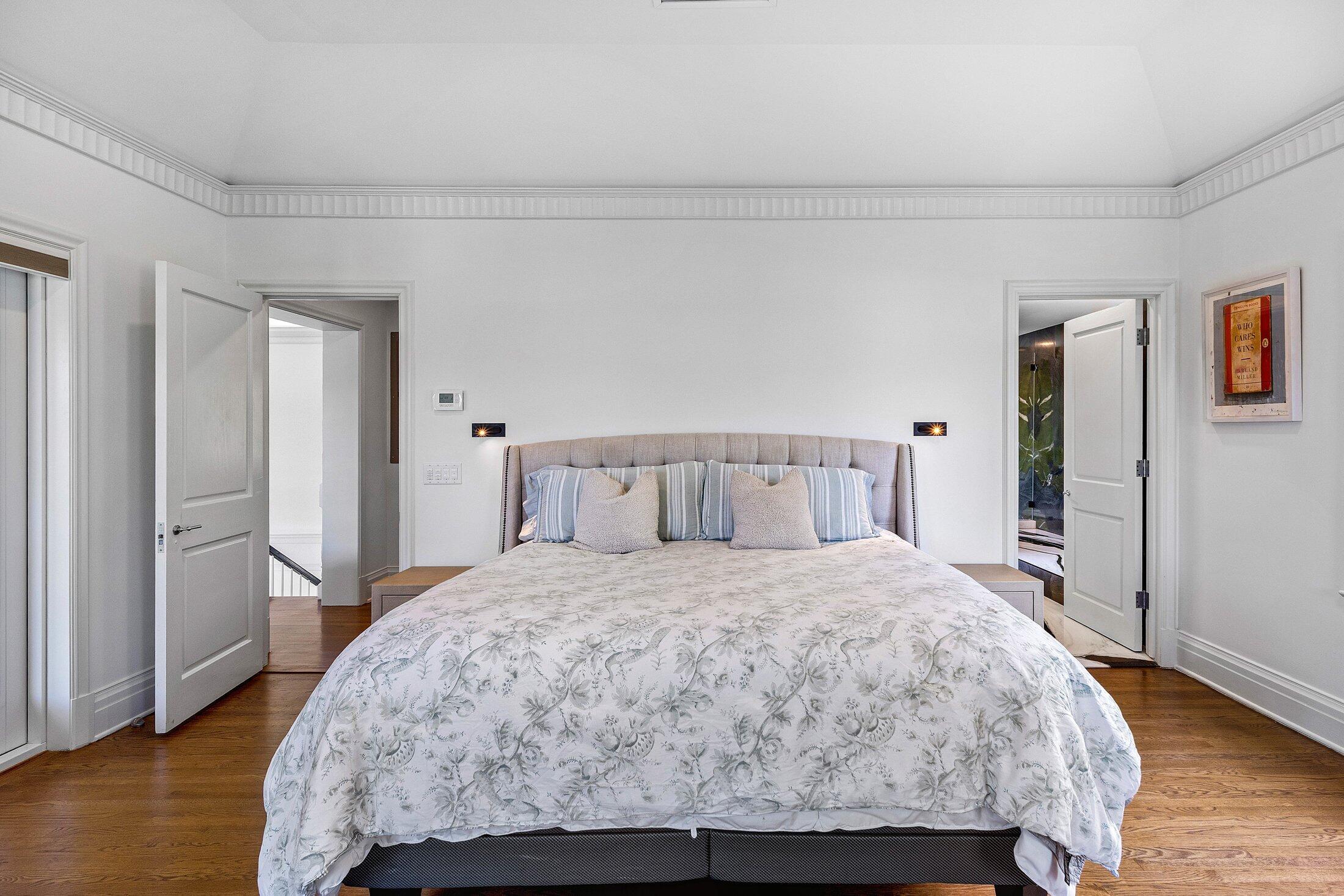 5 Osprey Court Ocean Ridge, FL 33435 - Photo 26 of 39 a bedroom with a bed and wooden floor