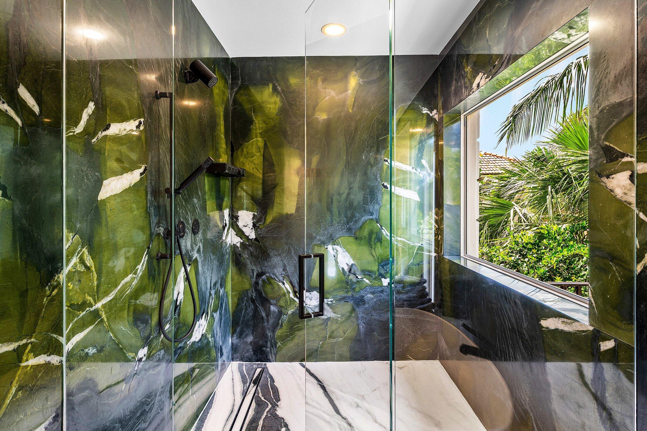 5 Osprey Court Ocean Ridge, FL 33435 - Photo 27 of 39 a bathroom with a glass door shower and a mirror