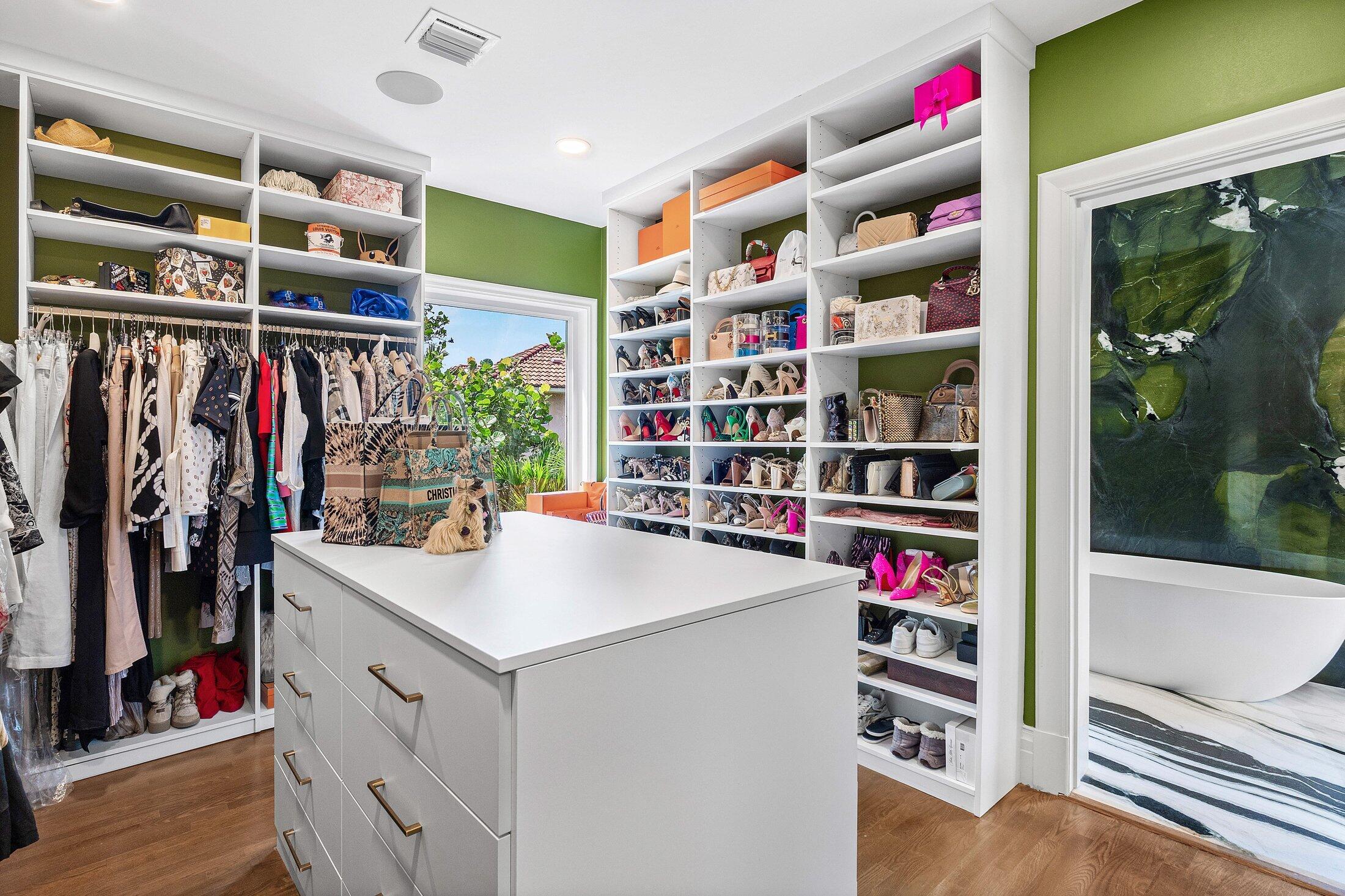 5 Osprey Court Ocean Ridge, FL 33435 - Photo 30 of 39 a view of walk in closet with clothes and shoes