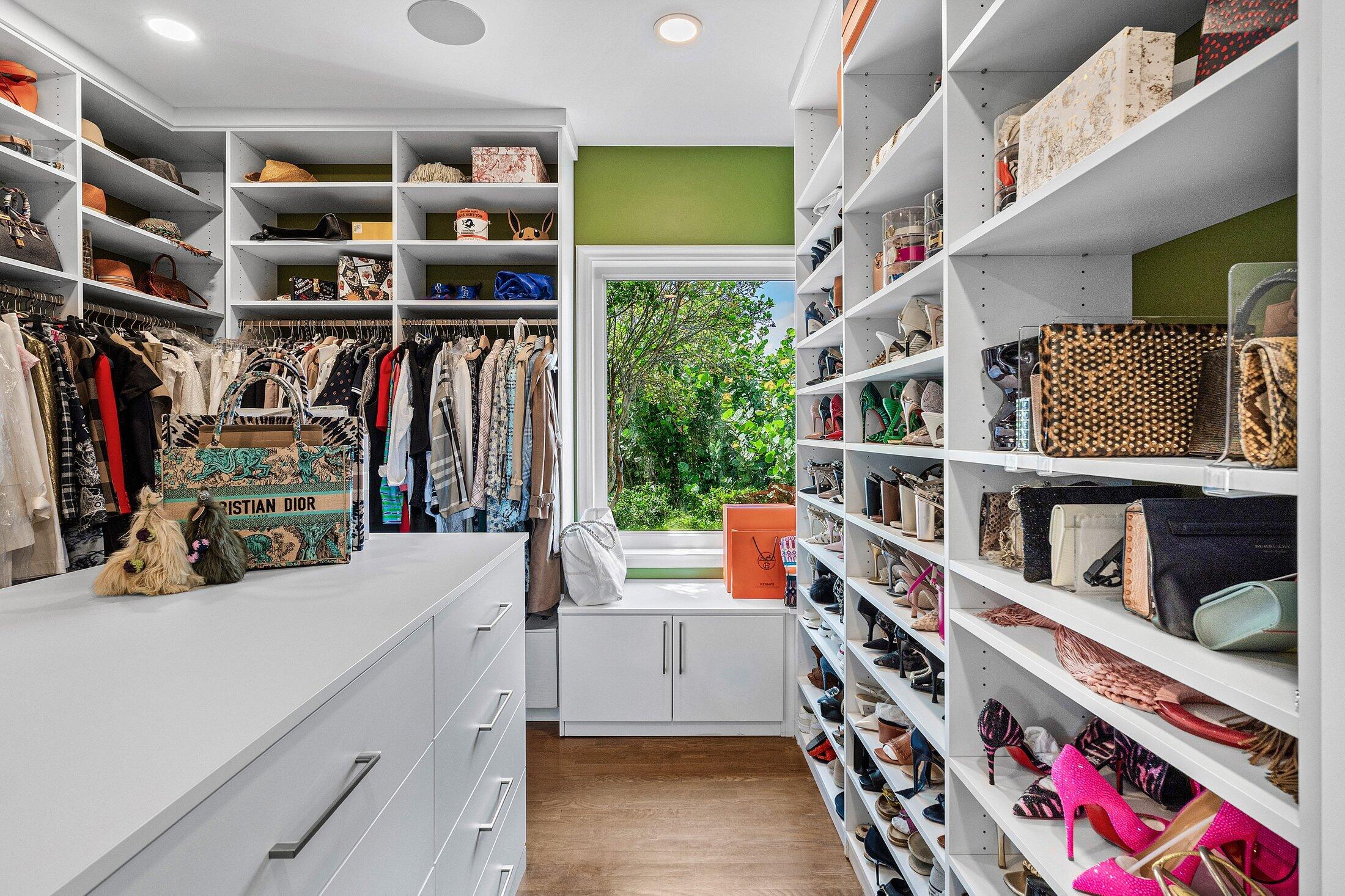 5 Osprey Court Ocean Ridge, FL 33435 - Photo 32 of 39 a view of walk in closet with clothes and shoes