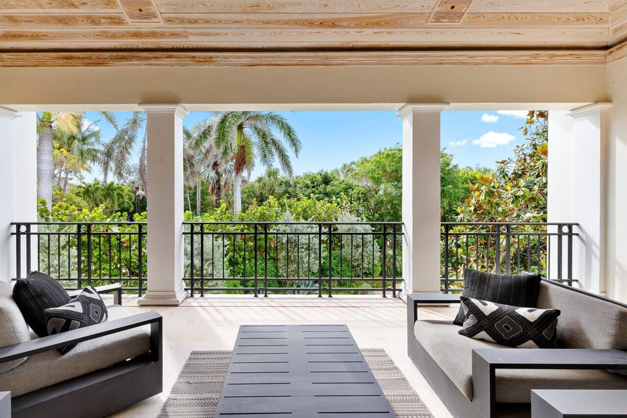 5 Osprey Court Ocean Ridge, FL 33435 - Photo 34 of 39 a living room with furniture and a floor to ceiling window