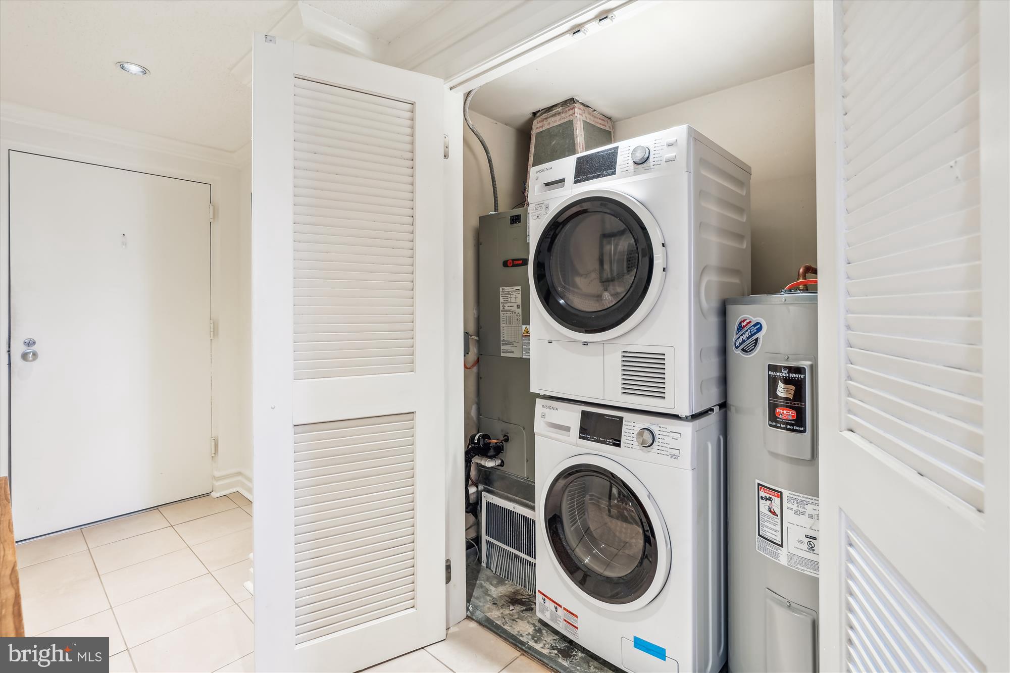 2630 Adams Mill Road Northwest, Unit 209 Washington, DC 20009 - Photo 27 of 47 a utility room with dryer and washer
