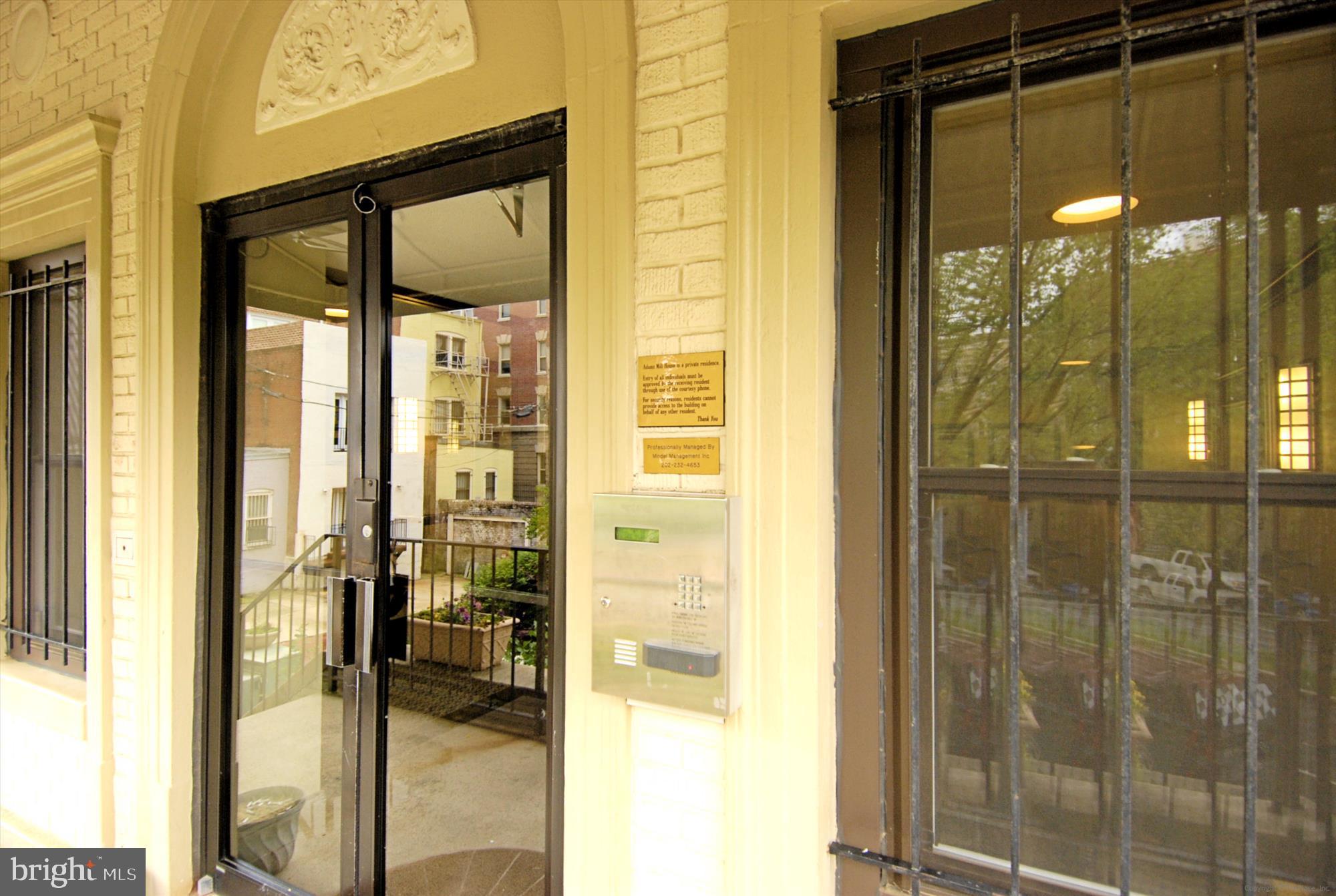 2630 Adams Mill Road Northwest, Unit 209 Washington, DC 20009 - Photo 31 of 47 a bathroom with a glass shower door