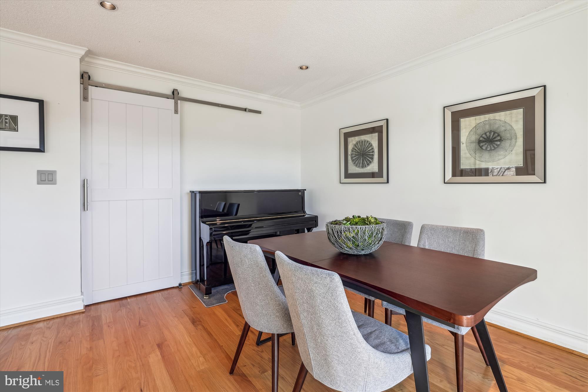 2630 Adams Mill Road Northwest, Unit 209 Washington, DC 20009 - Photo 6 of 47 a view of a dining room with furniture and wooden floor