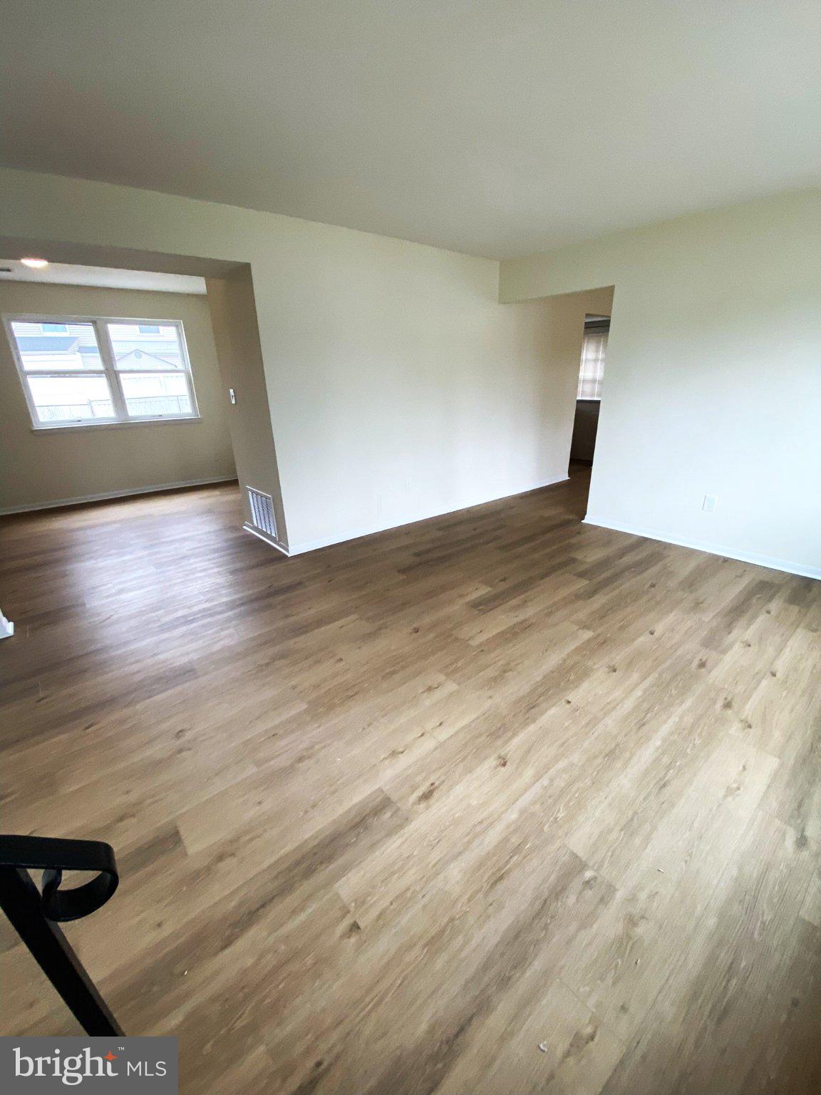 7707 Queens Road Pasadena, MD 21122 - Photo 5 of 19 Spacious, sunlit living area awaits.