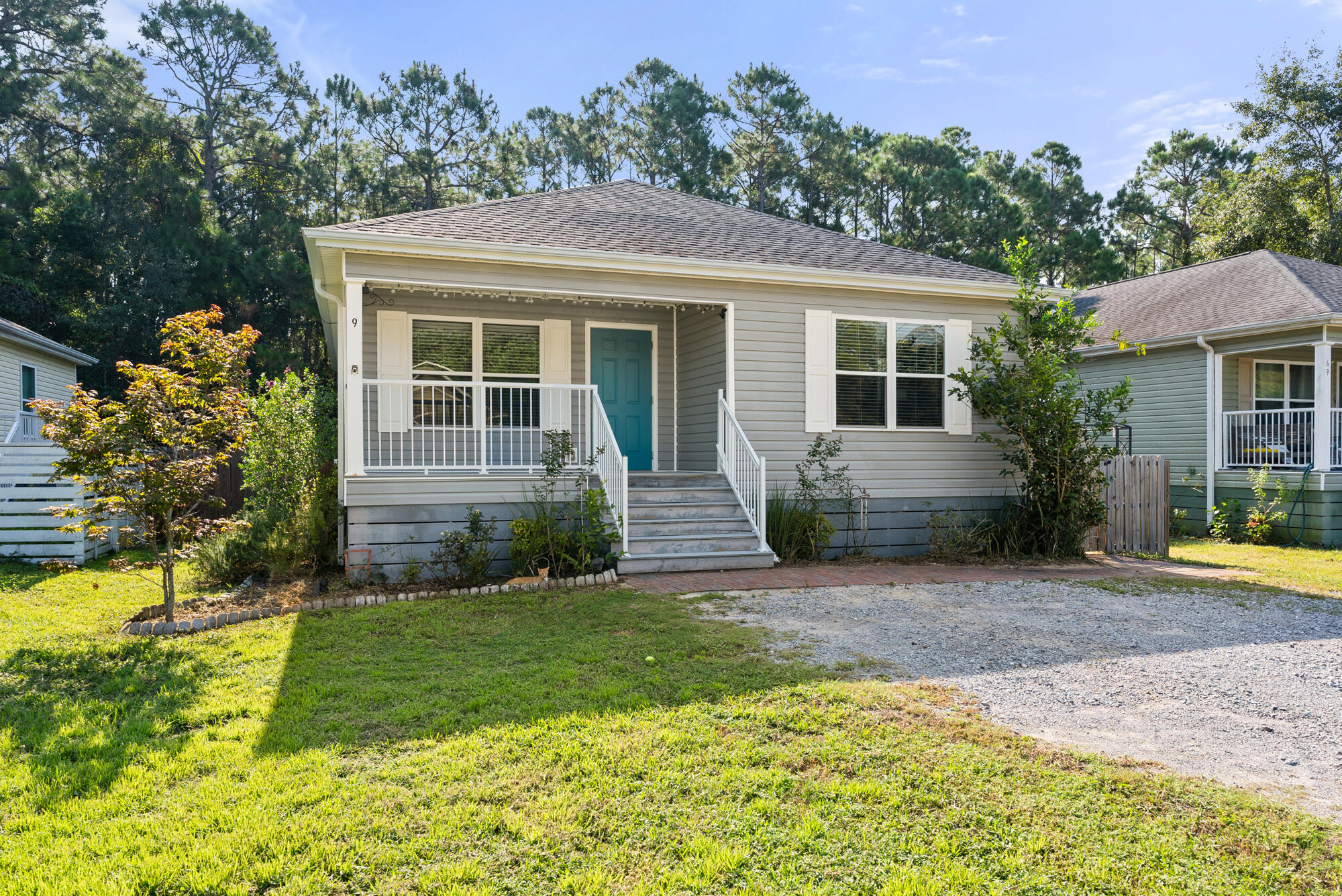 59 6th Street Santa Rosa Beach, FL 32459 - Photo 2 of 43 a front view of a house with garden